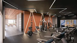 Interior de uma academia com equipamentos de ginástica.
