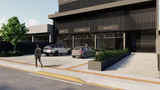 Fachada de um prédio comercial com lojas numeradas em Lajeado, Brasil.