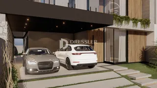 Fachada moderna de uma residência em Lajeado com garagem e paisagismo.