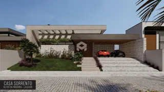 Fachada moderna de uma casa em Lajeado, Brasil, com jardim e garagem.