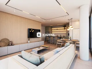 Sala de estar moderna com sofá e área de jantar integrada.