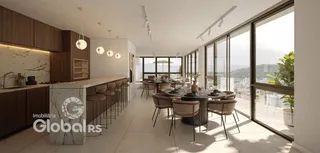 Ambiente moderno de sala de jantar e cozinha com vista para a paisagem.