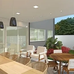 Sala de estar com móveis e grandes janelas em um imóvel em Lajeado.
