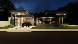 Fachada moderna de uma casa em Lajeado, Brasil, à noite.