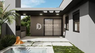 A fachada de uma casa moderna em Lajeado, Brasil, com área externa e piscina.