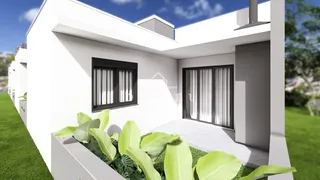 Fachada moderna de uma casa em Lajeado, Brasil, com jardim na frente.