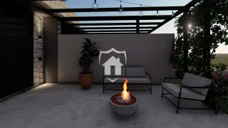 Área externa com lareira e mobiliário ao ar livre.
