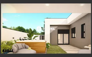 Área externa com sofá e deck de madeira em uma residência moderna.