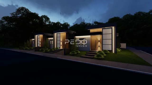 Fachada moderna de uma residência em Lajeado, Brasil, com iluminação exterior.