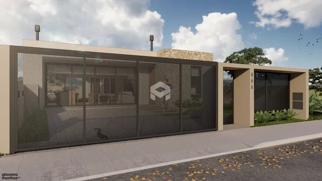 Fachada de uma residência com portão de metal em Lajeado.