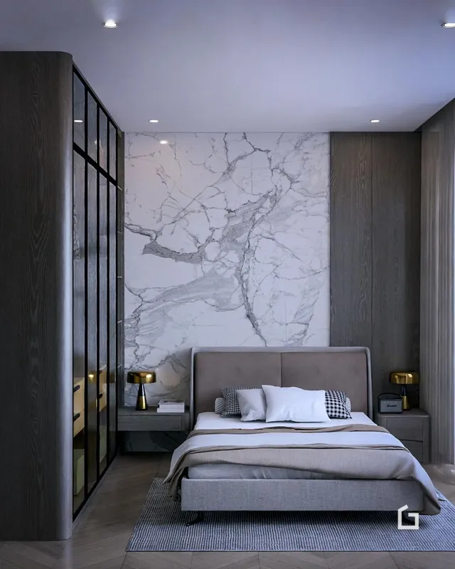 Quarto com cabeceira e decoração de parede em mármore
