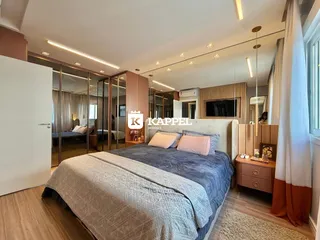 Quarto com cama grande e decoração moderna.