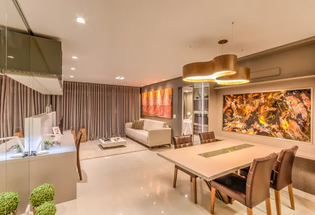 Sala de estar e jantar moderna com decoração contemporânea.