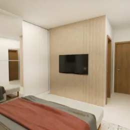 Quarto com cama e televisão em ambiente interno.