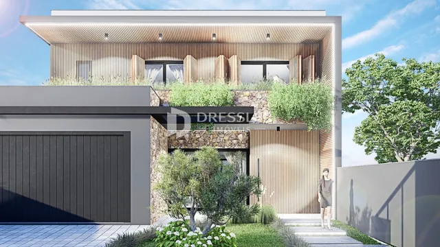 Fachada moderna de uma residência em Lajeado, Brasil, com jardim frontal.