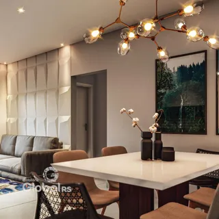 Sala de estar com mesa de jantar e decoração moderna em um imóvel.
