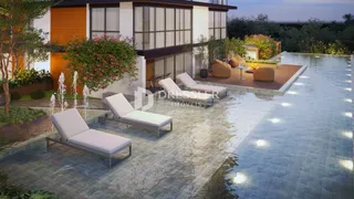 A fachada de uma residência moderna com área de lazer e piscina.
