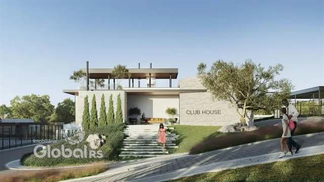 Fachada de uma casa moderna com paisagismo e jardim.