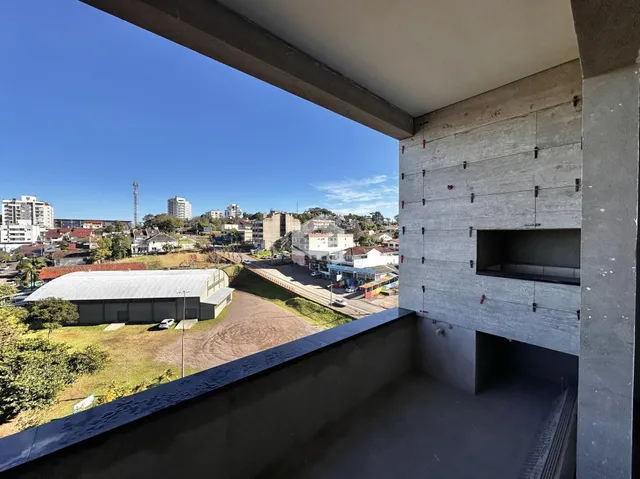 Vista da propriedade em Lajeado, Brasil, mostrando paisagem e edifícios distantes.
