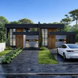Fachada moderna de uma residência com jardim e área pavimentada em Lajeado.