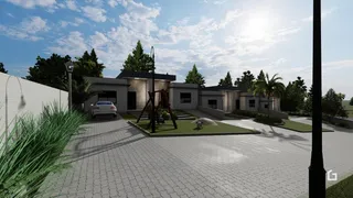 A fachada de uma residência moderna em Lajeado, Brasil, com jardim e entrada pavimentada.