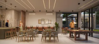 Uma sala de jantar moderna com grandes portas de vidro e ambiente aberto.