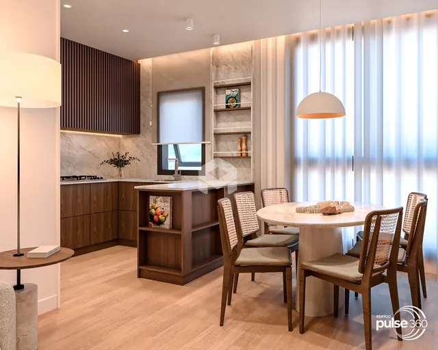 Sala de estar com cozinha integrada e mesa de jantar em um apartamento.