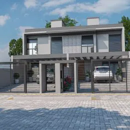 Fachada moderna de uma residência em Lajeado, Brasil, com revestimento de pedra e grandes painéis de vidro.