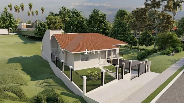 Fachada de uma casa em Lajeado, Brasil, com jardim frontal e cerca.