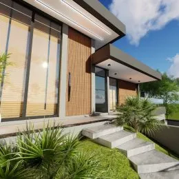 Fachada moderna de uma residência em Lajeado, Brasil, com grandes painéis de vidro e degraus externos.
