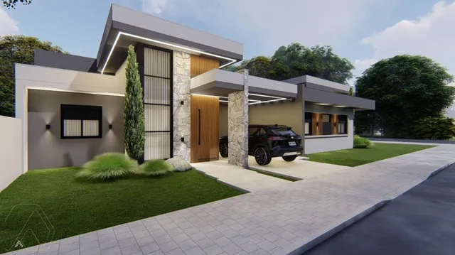Fachada moderna de uma casa residencial em Lajeado, Brasil, com paisagismo frontal.
