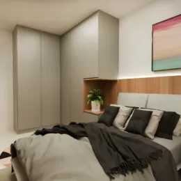 Quarto com cama e armários em um ambiente interno.