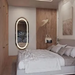 Quarto com cama de casal e cabeceira de madeira.