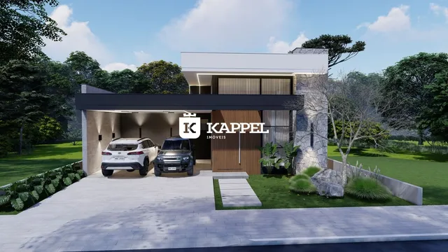 Fachada moderna de uma residência com paisagismo e área de garagem em Lajeado.