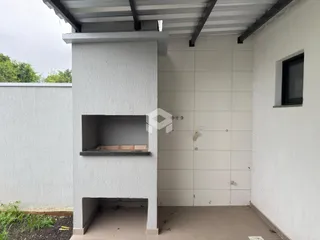 Parede externa de uma residência em Lajeado, Brasil, mostrando uma estrutura de alvenaria.