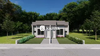 Fachada moderna de uma casa em Lajeado, Brasil, com paisagismo verde.