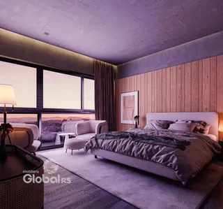 Quarto moderno com grande janela e vista para a paisagem.