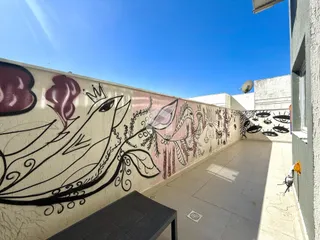 Parede externa de um imóvel em Lajeado, Brasil, com arte mural.