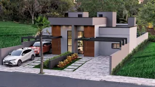 Fachada moderna de uma residência em Lajeado, Brasil, com paisagismo frontal.