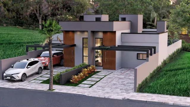 Fachada moderna de uma residência em Lajeado, Brasil, com paisagismo frontal.