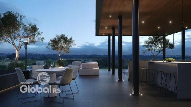 Vista de uma área de lazer externa moderna com mobiliário em Lajeado.
