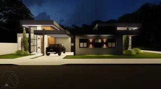 Fachada moderna de uma casa residencial iluminada à noite.