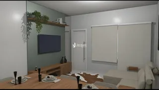 Sala de estar com piso de madeira e televisão na parede.
