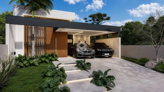 Fachada moderna de uma residência com jardim e entrada coberta.