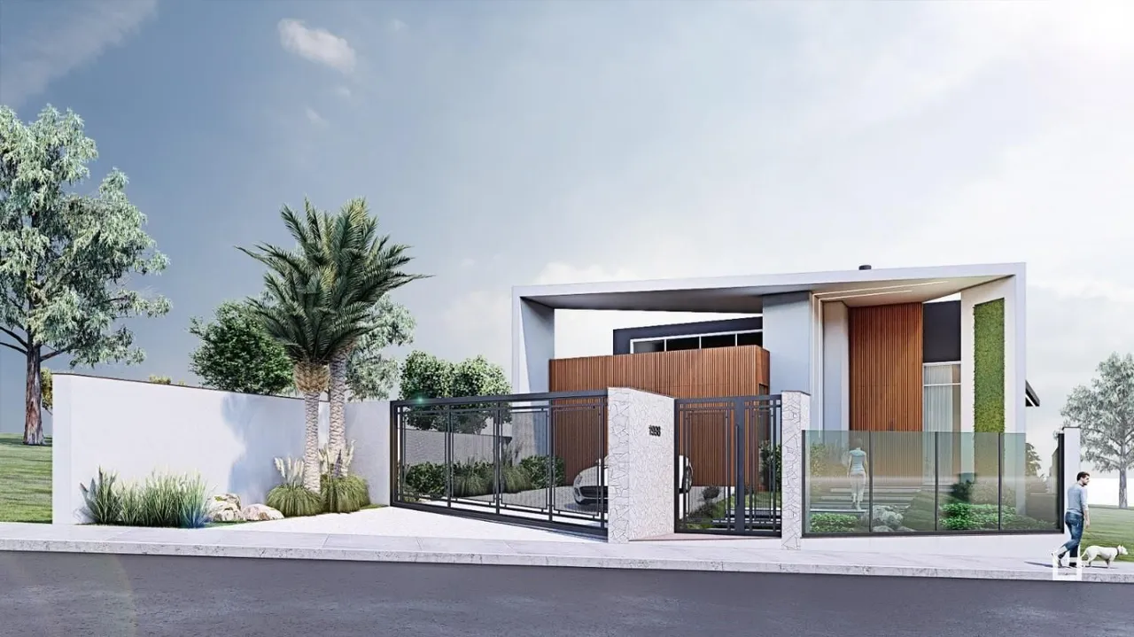 Fachada moderna de uma residência em Lajeado, Brasil, com muro e portão de vidro.