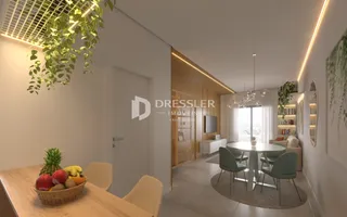 Sala de estar e jantar moderna com iluminação clara.