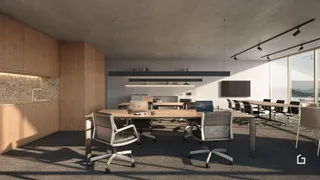 Ambiente de escritório moderno com mesa de reunião e janelas amplas.