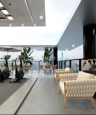Ambiente moderno de academia com área de estar em um apartamento.