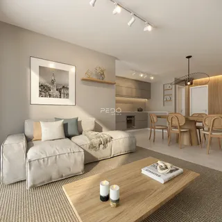 Sala de estar moderna com decoração clara e ambiente integrado.