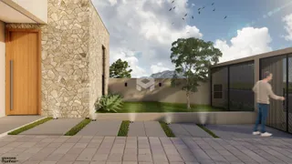 Fachada de uma residência com parede de pedra e porta de madeira em Lajeado.